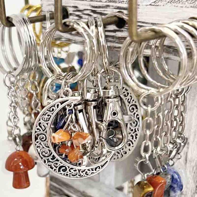 Close up of keyrings with mushrooms and moons