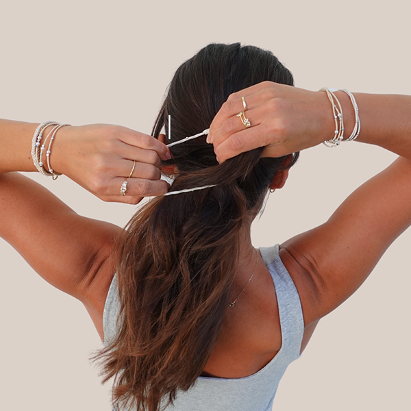 Gypsea Bands hero image. putting band in a ponytail